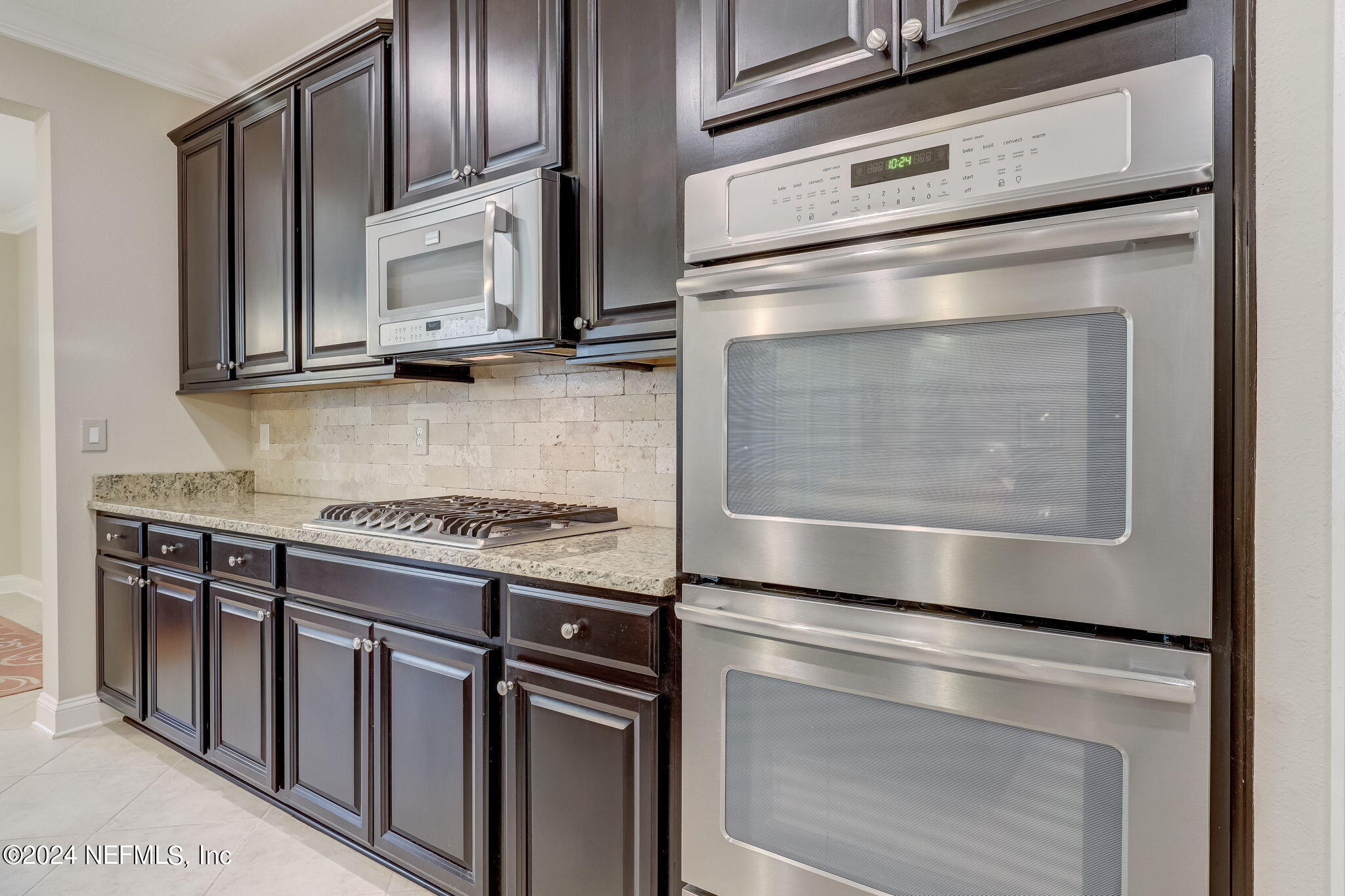 577 Aspen Leaf Drive Jacksonville, FL 32081 - Photo 10 of 106 a kitchen with granite countertop cabinets stainless steel appliances and a counter space
