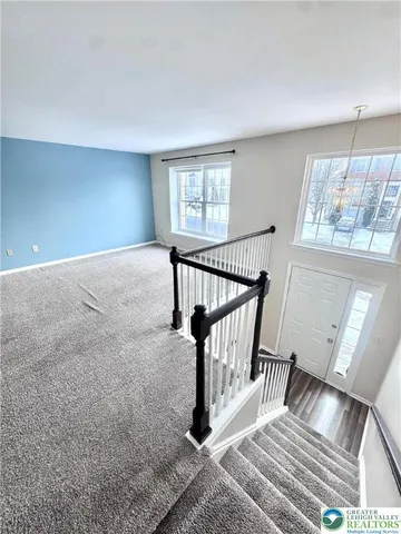 a view of entryway with wooden floor