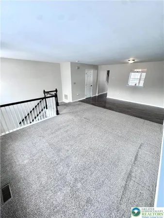 a view of livingroom with furniture and stairs
