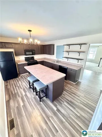 a view of a swimming pool and lounge chair