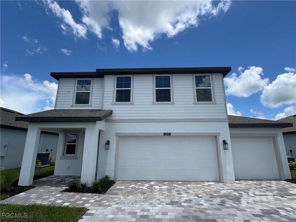 237 Moonlit Lk Trail Lehigh Acres, FL 33974 - Photo 1 of 18 a front view of a house