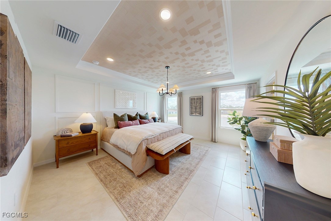 237 Moonlit Lk Trail Lehigh Acres, FL 33974 - Photo 7 of 18 a spacious bedroom with a bed and a chandelier