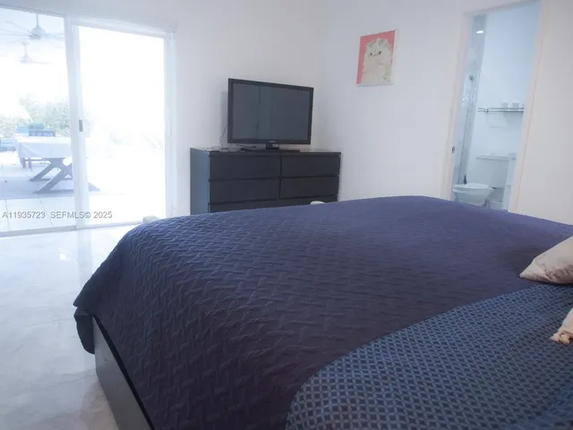 a bathroom with a toilet sink and shower