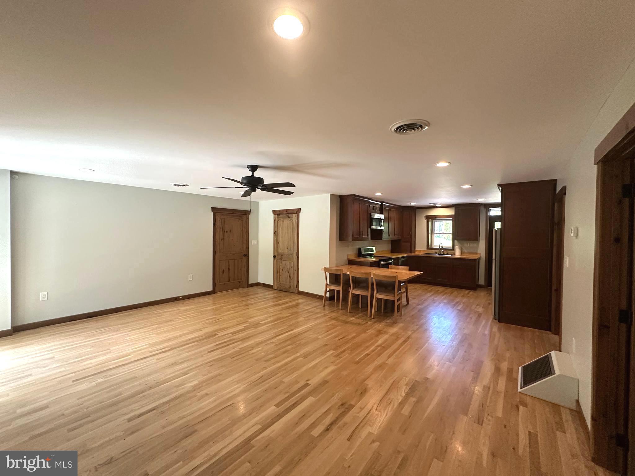 3720 Basford Road Frederick, MD 21703 - Photo 11 of 38 a view of a livingroom with furniture and a table chairs