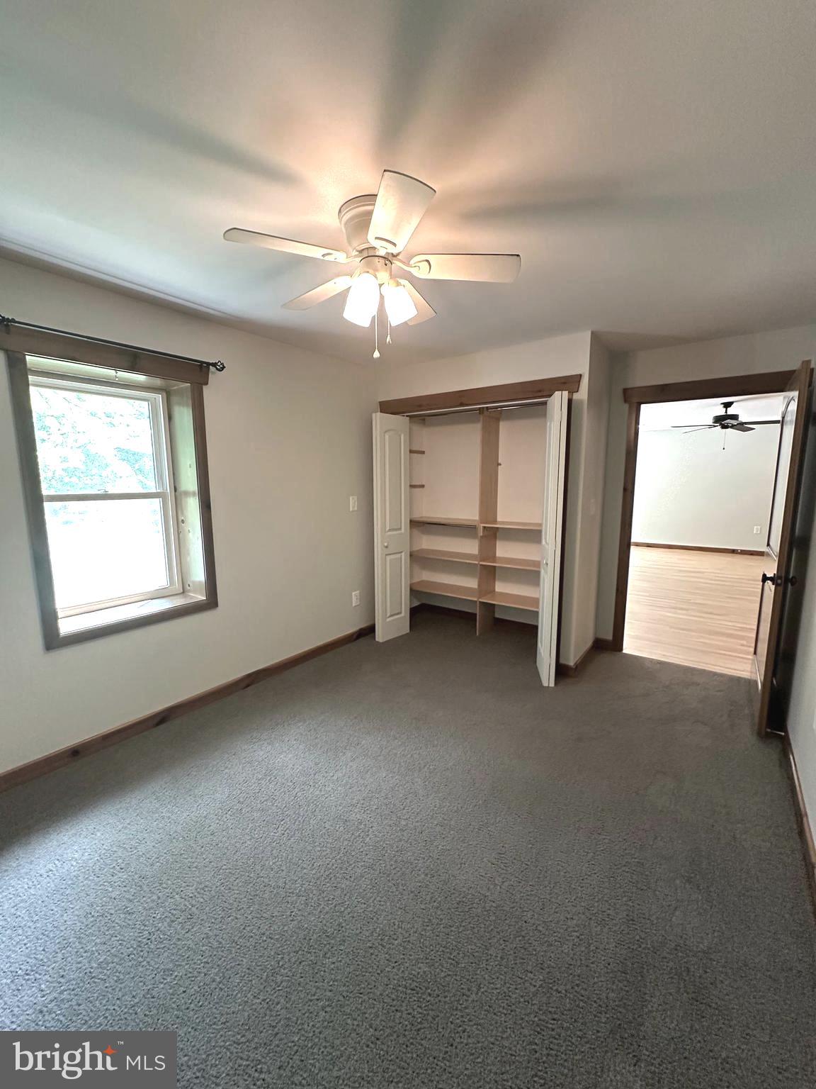 3720 Basford Road Frederick, MD 21703 - Photo 28 of 38 an empty room with chandelier fan and windows