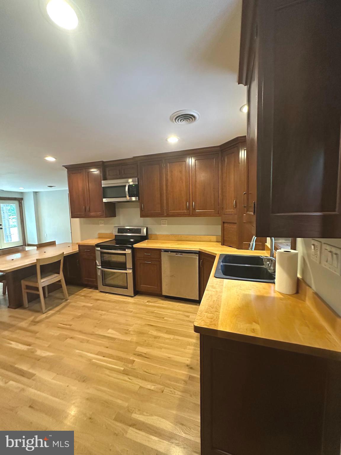 3720 Basford Road Frederick, MD 21703 - Photo 5 of 38 a kitchen with stainless steel appliances wooden cabinets and a counter top space