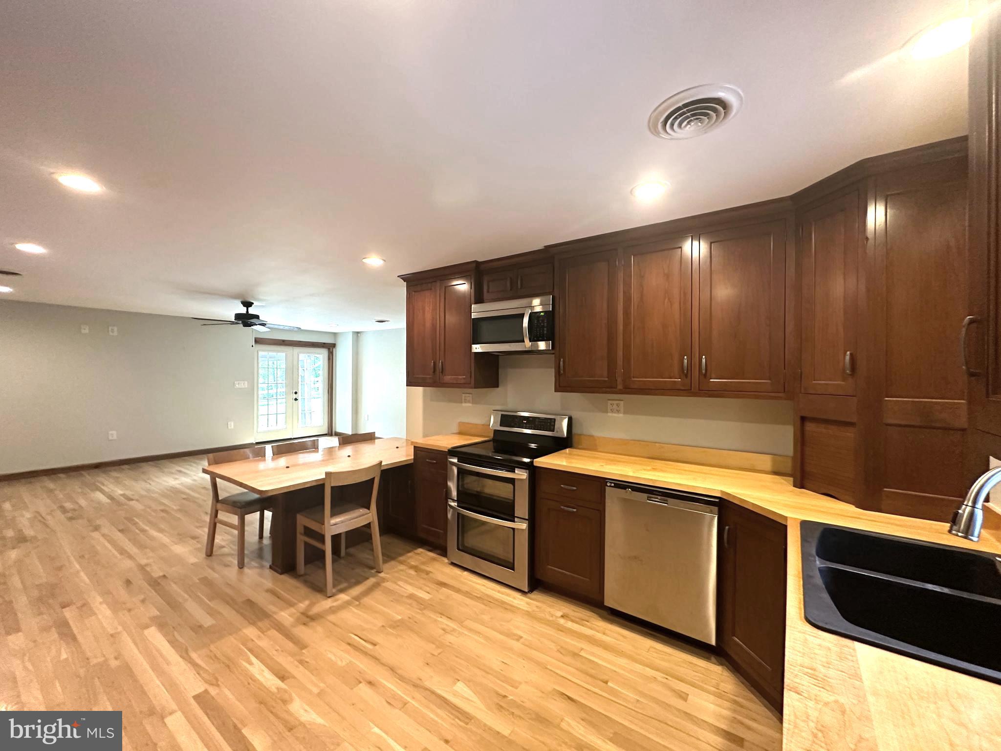 3720 Basford Road Frederick, MD 21703 - Photo 6 of 38 a kitchen with stainless steel appliances granite countertop a sink counter space cabinets and a stove