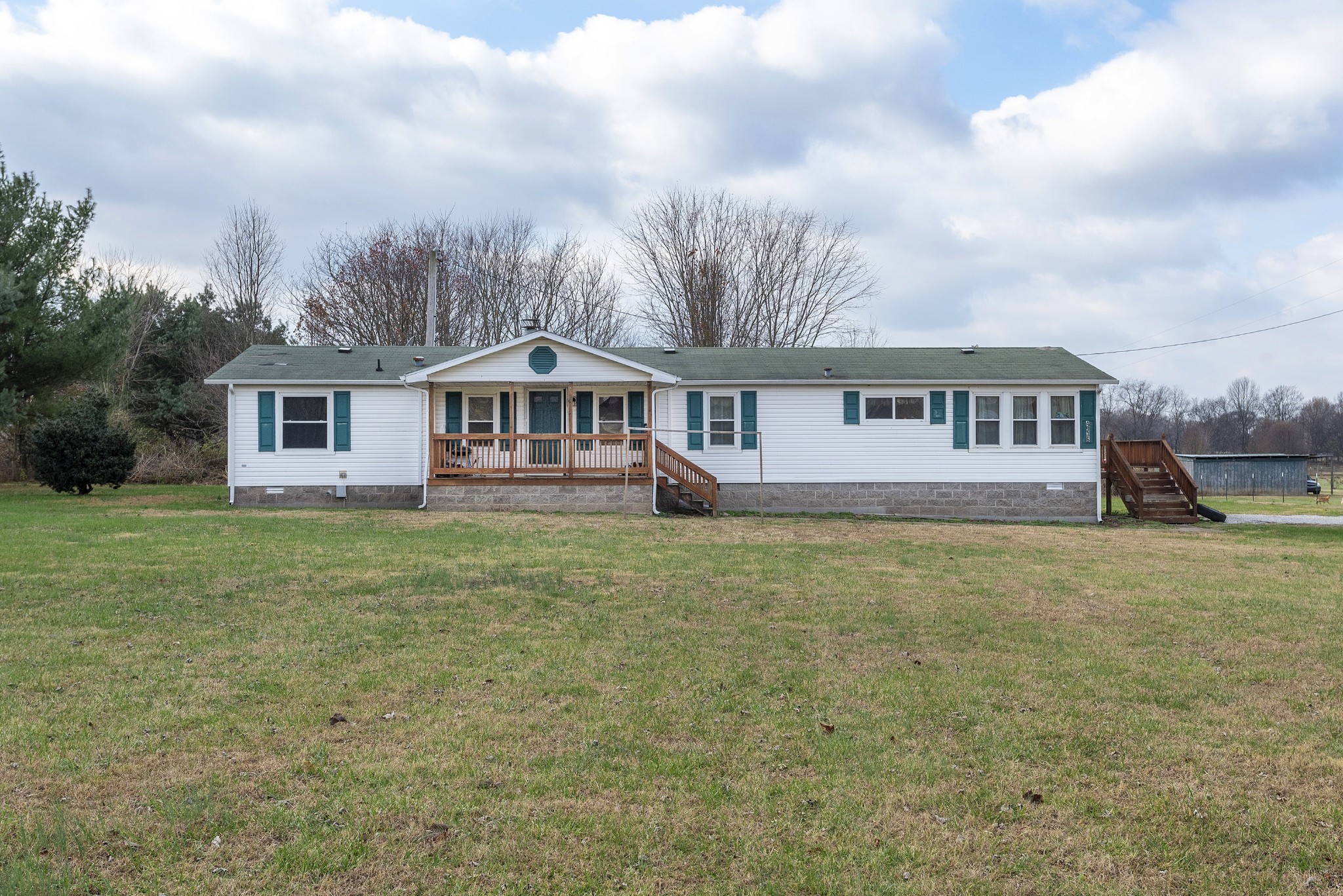 4936 Youngville Road Springfield, TN 37172 - Photo 1 of 20 a view of a big house with a big yard and large trees
