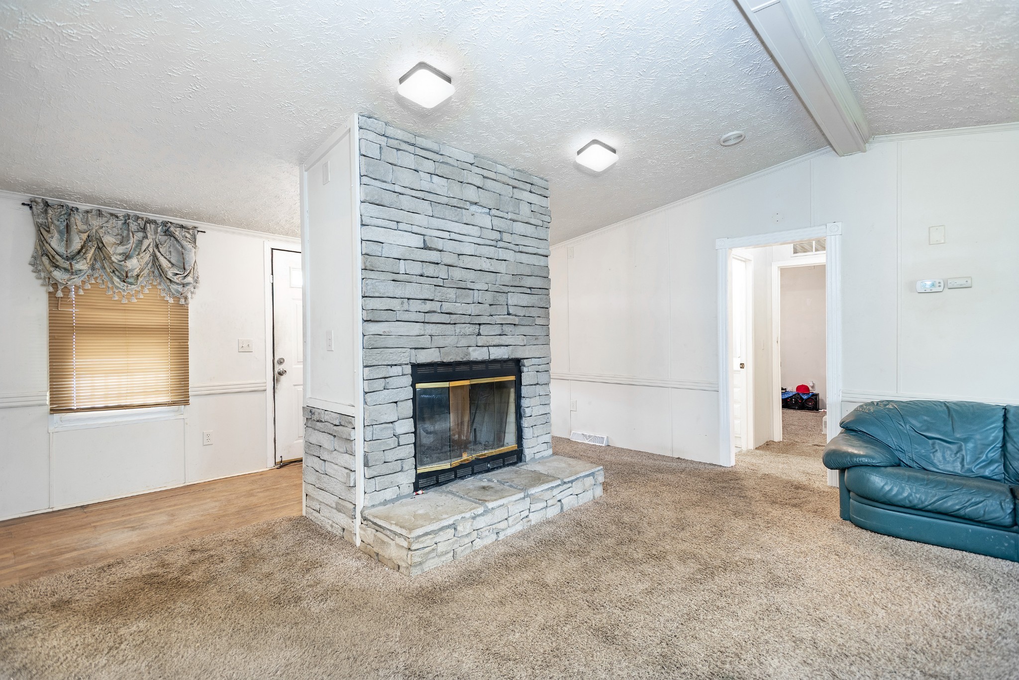 4936 Youngville Road Springfield, TN 37172 - Photo 2 of 20 a living room with furniture and a fireplace
