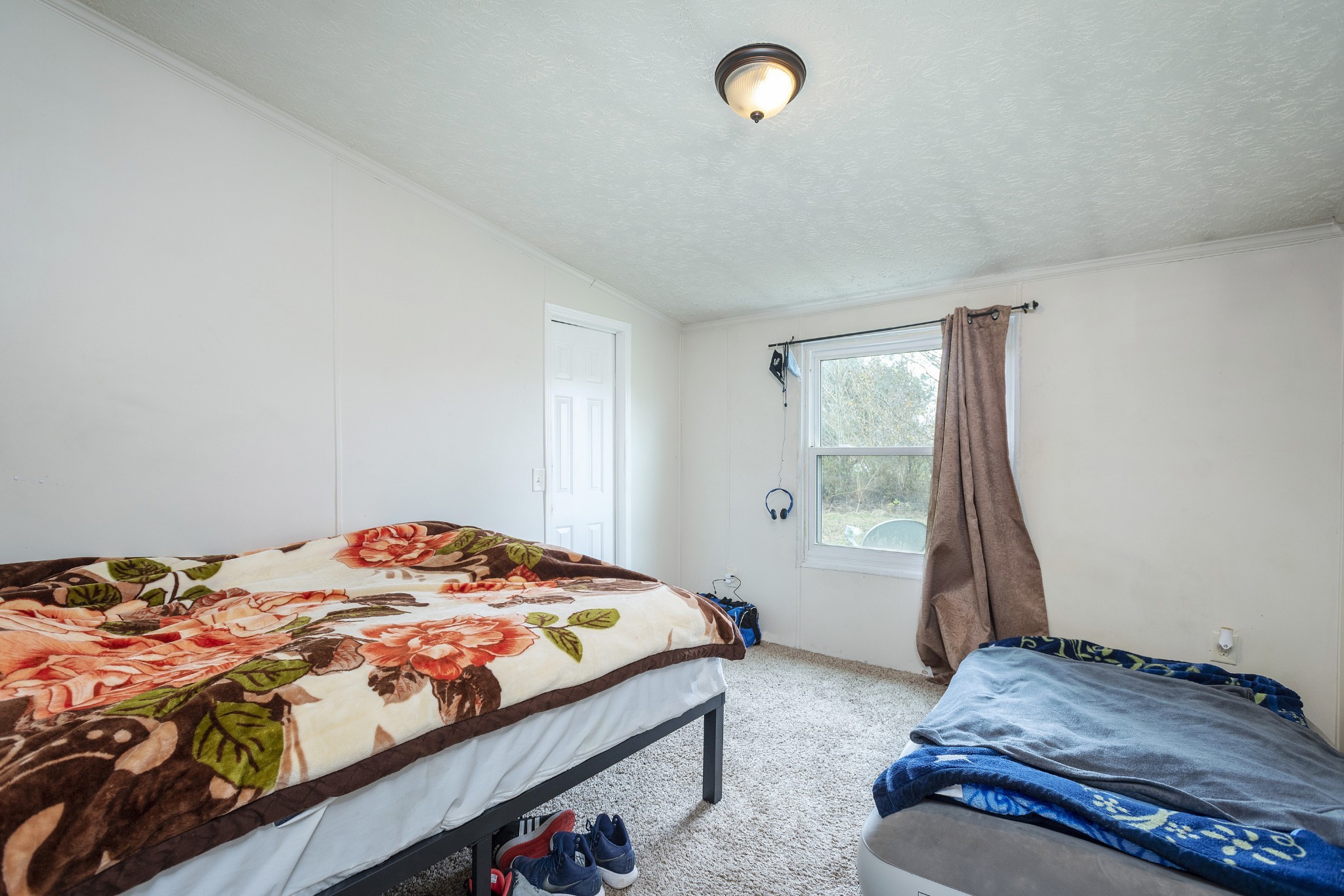 4936 Youngville Road Springfield, TN 37172 - Photo 12 of 20 a bedroom with a bed and a window