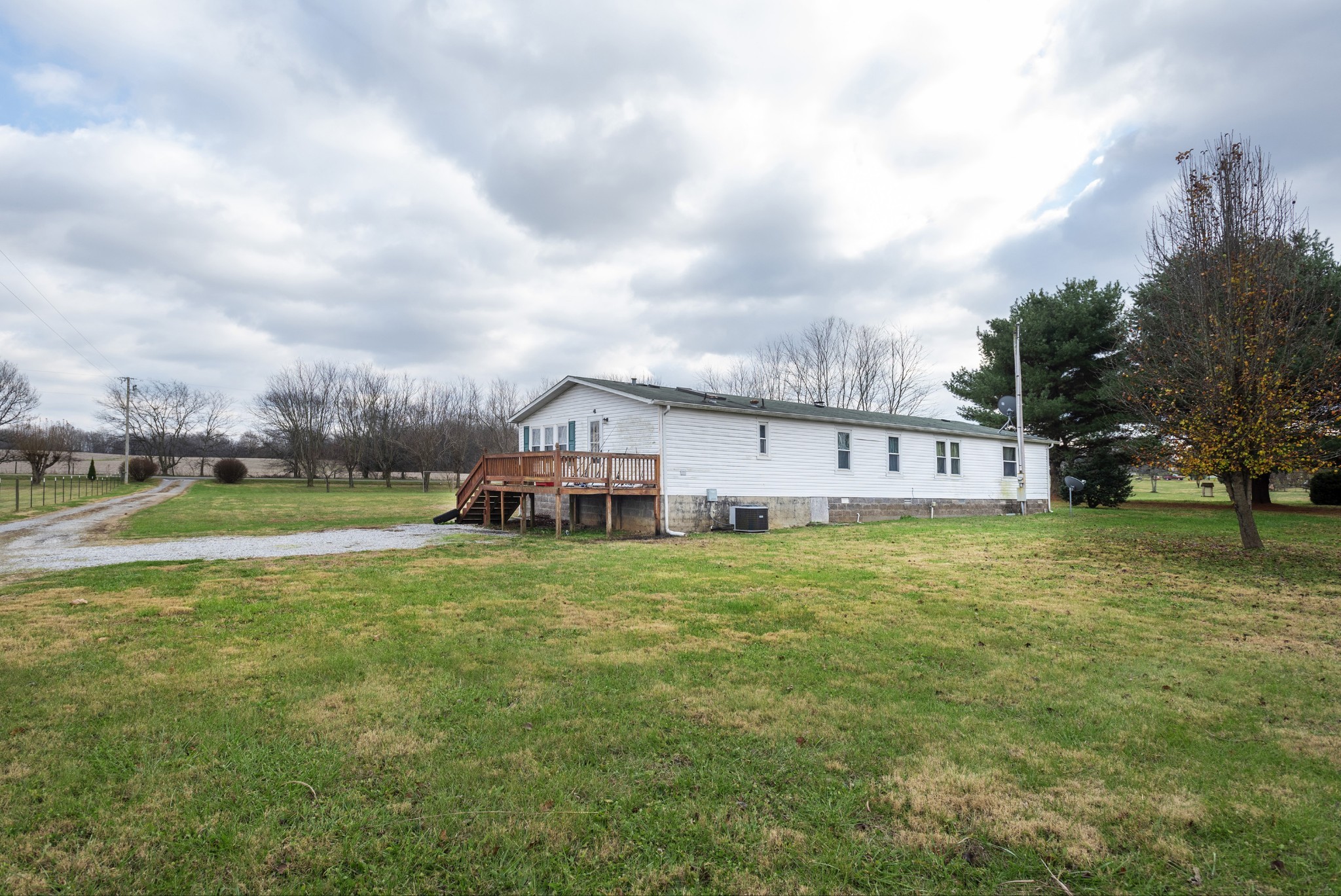 4936 Youngville Road Springfield, TN 37172 - Photo 15 of 20 a view of a house with a big yard and large trees