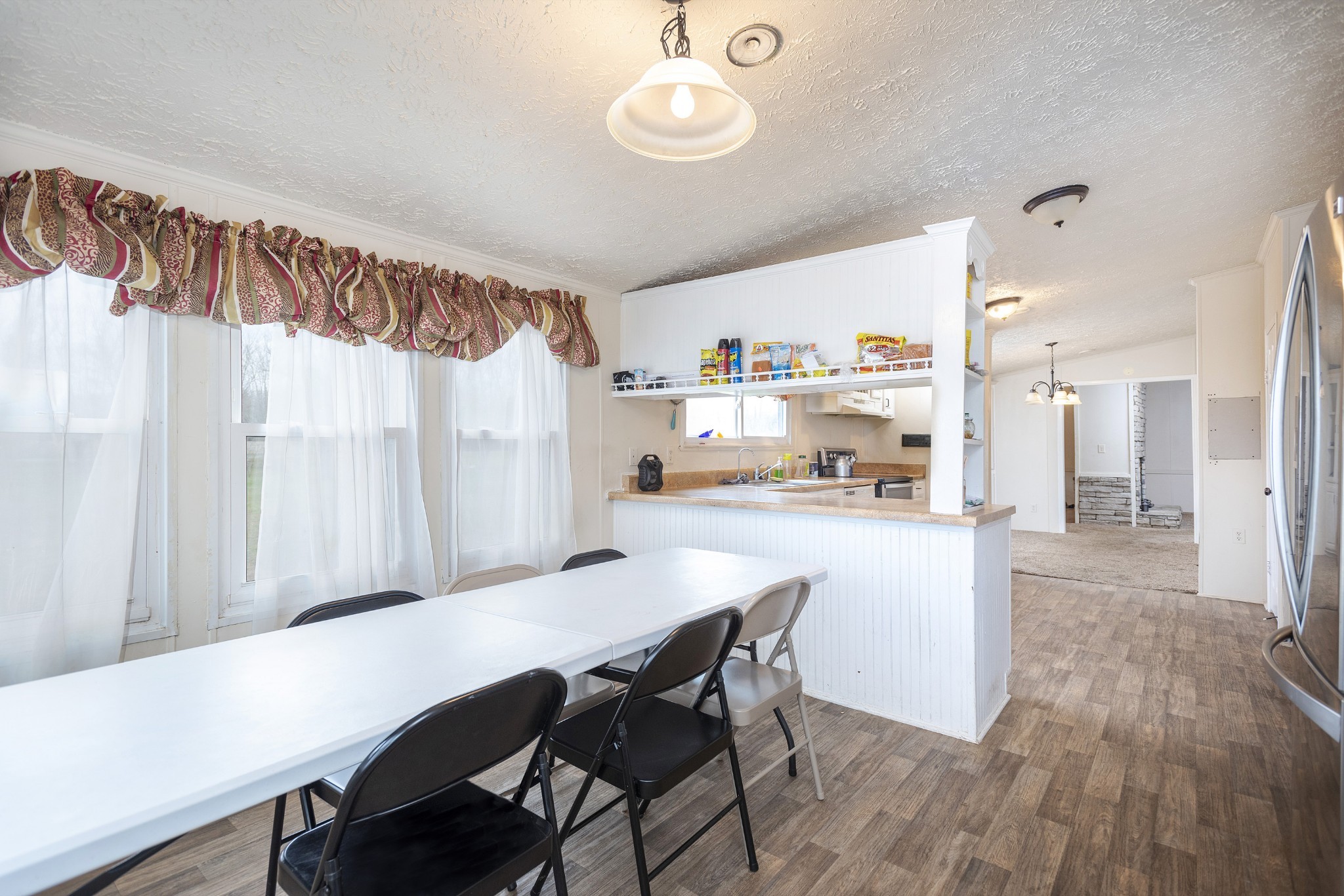 4936 Youngville Road Springfield, TN 37172 - Photo 7 of 20 a view of a dining room with furniture window and wooden floor