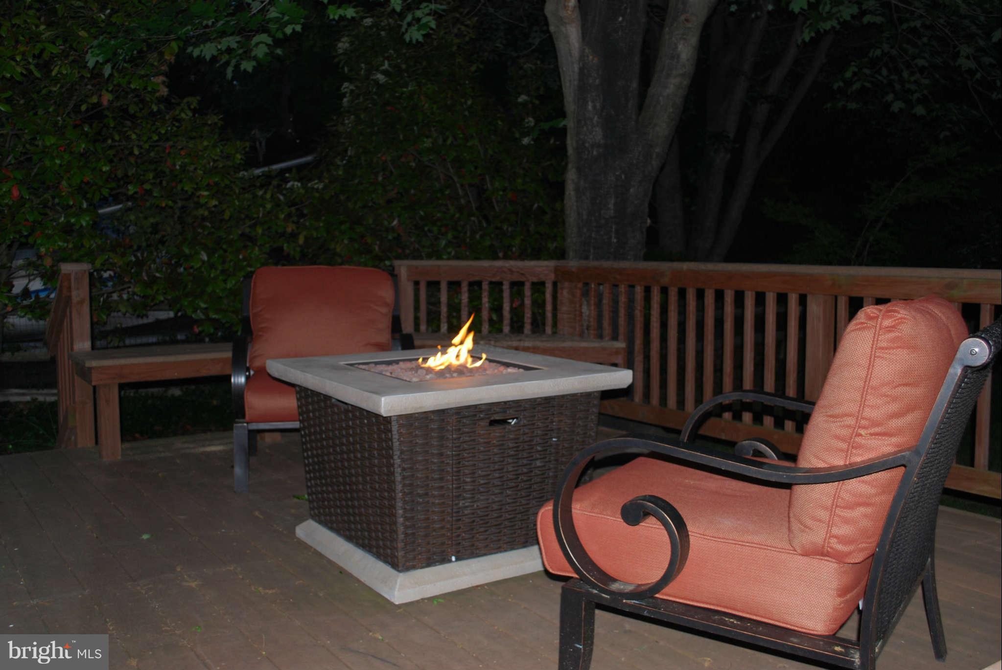 7609 Range Road Alexandria, VA 22306 - Photo 21 of 30 Enjoy the Deck at Dusk with the Fire Pit Lit