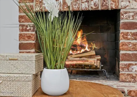 a living room with furniture and a dining table