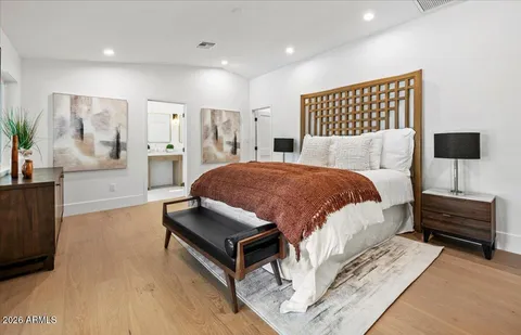a dining room with furniture water view and a floor to ceiling window