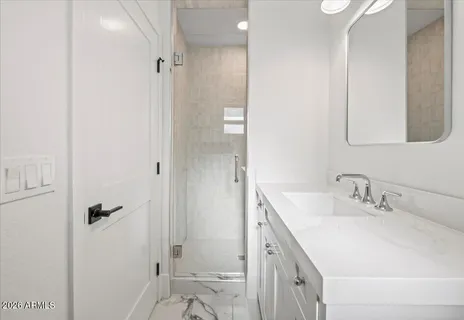 a bathroom with a double vanity sink and a mirror