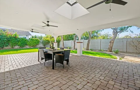 a kitchen with a sink a stove and cabinets