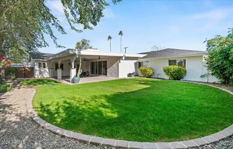 a view of a back yard of a house