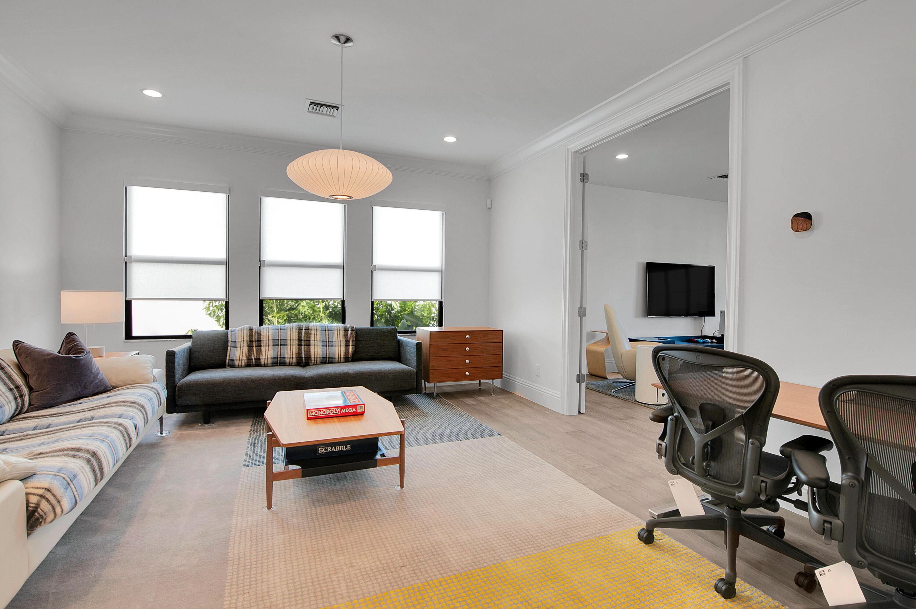 7480 Northwest 26th Way Boca Raton, FL 33496 - Photo 25 of 111 a living room with furniture and a flat screen tv
