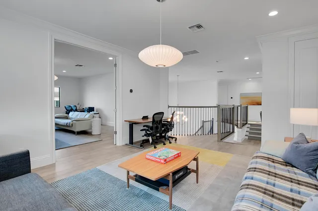 a white toilet sitting next to a window