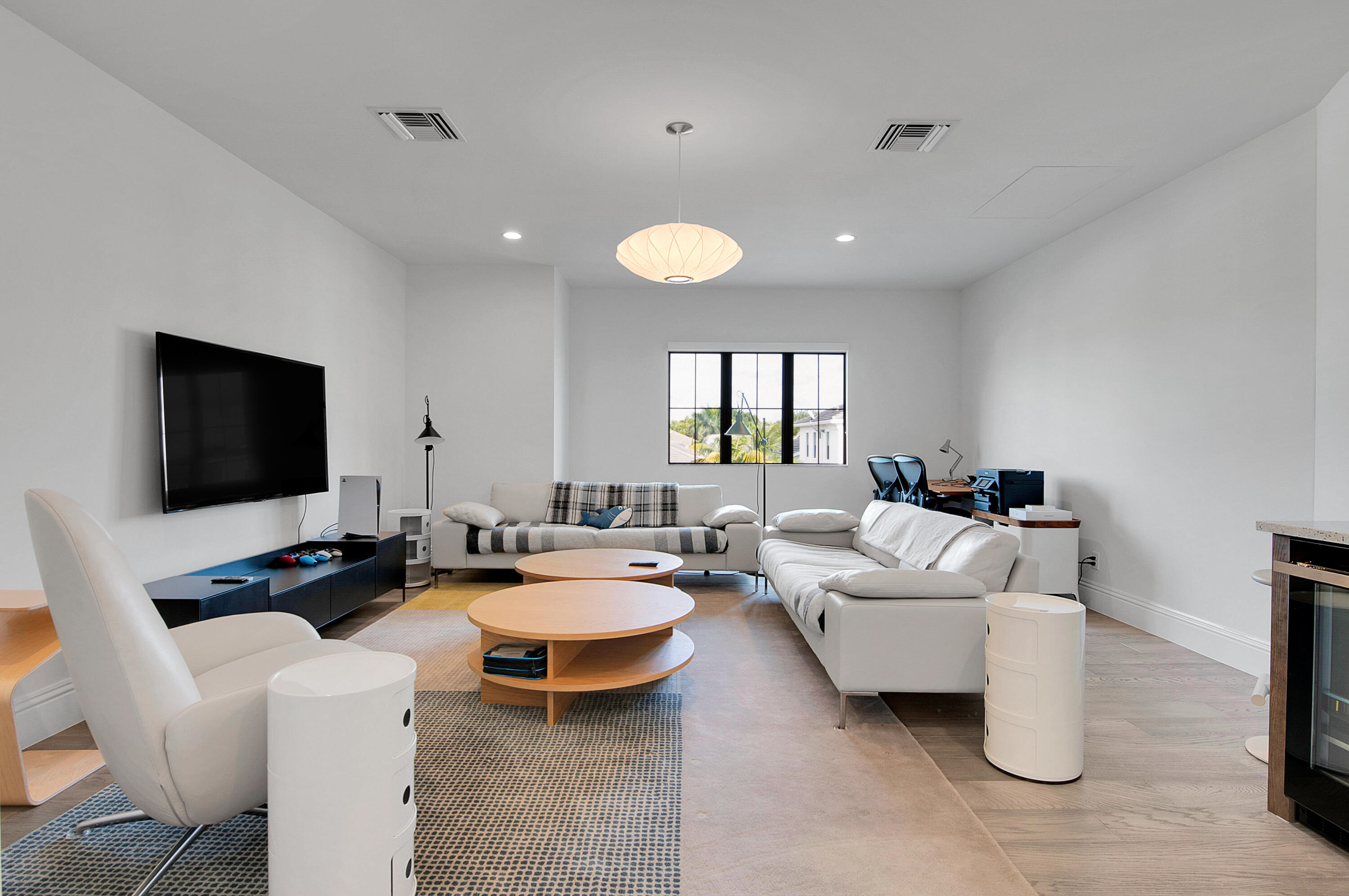 7480 Northwest 26th Way Boca Raton, FL 33496 - Photo 27 of 111 a living room with furniture and a flat screen tv