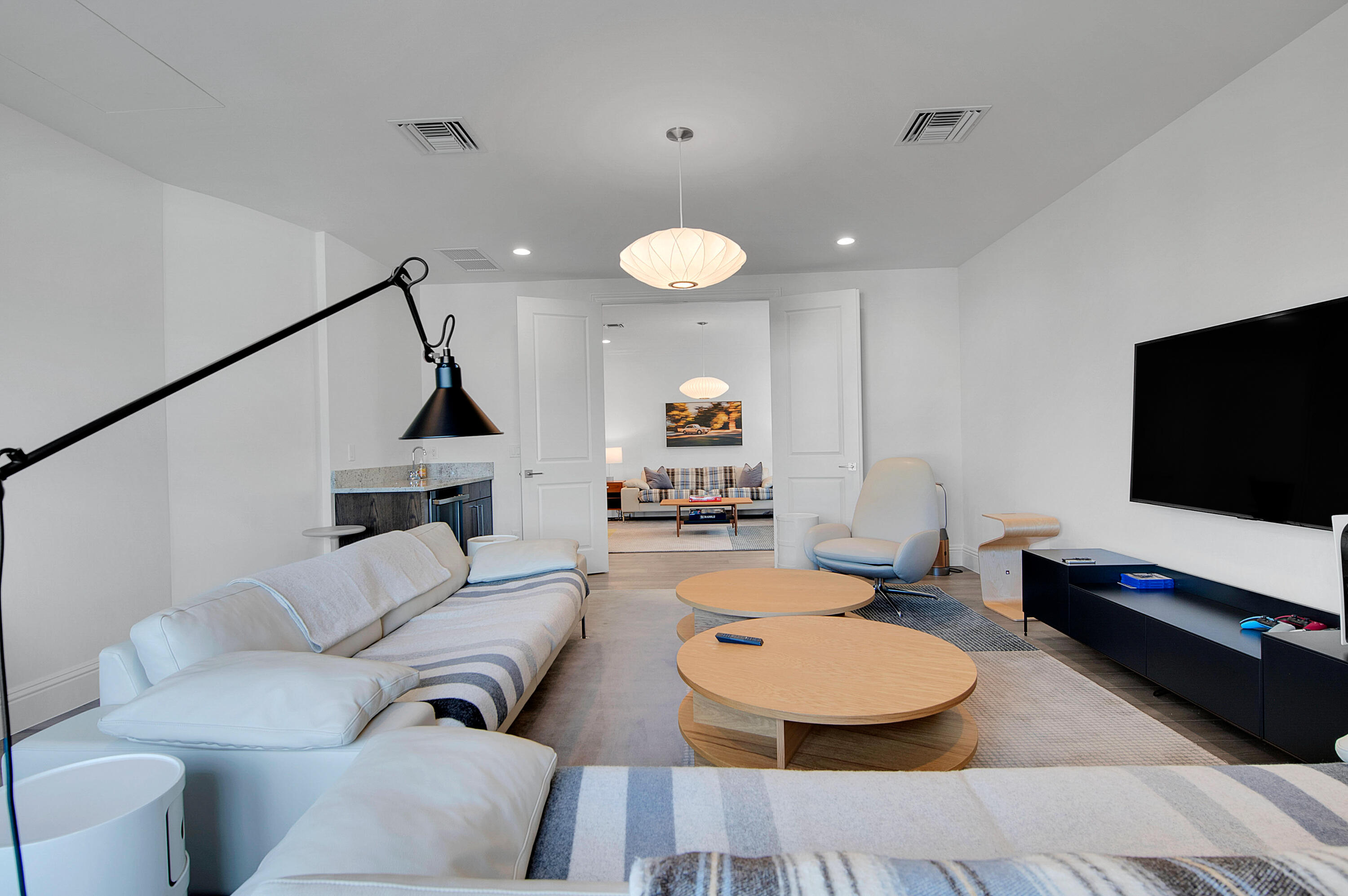 7480 Northwest 26th Way Boca Raton, FL 33496 - Photo 29 of 111 a living room with furniture and a flat screen tv