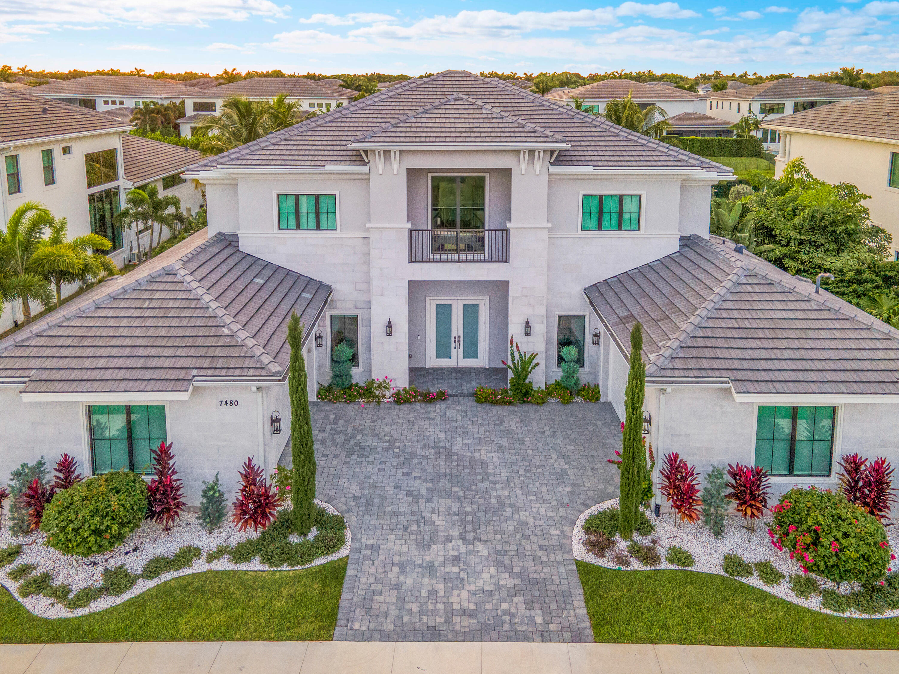 7480 Northwest 26th Way Boca Raton, FL 33496 - Photo 3 of 111 front view of a house with a yard