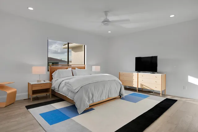 a bedroom with a bed and a couch