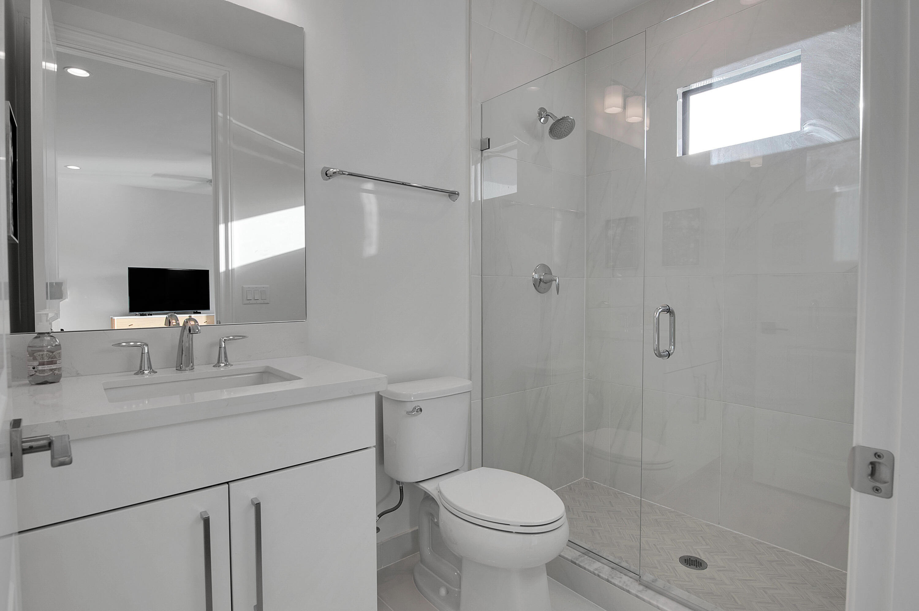 7480 Northwest 26th Way Boca Raton, FL 33496 - Photo 35 of 111 a bathroom with a sink toilet a mirror and shower