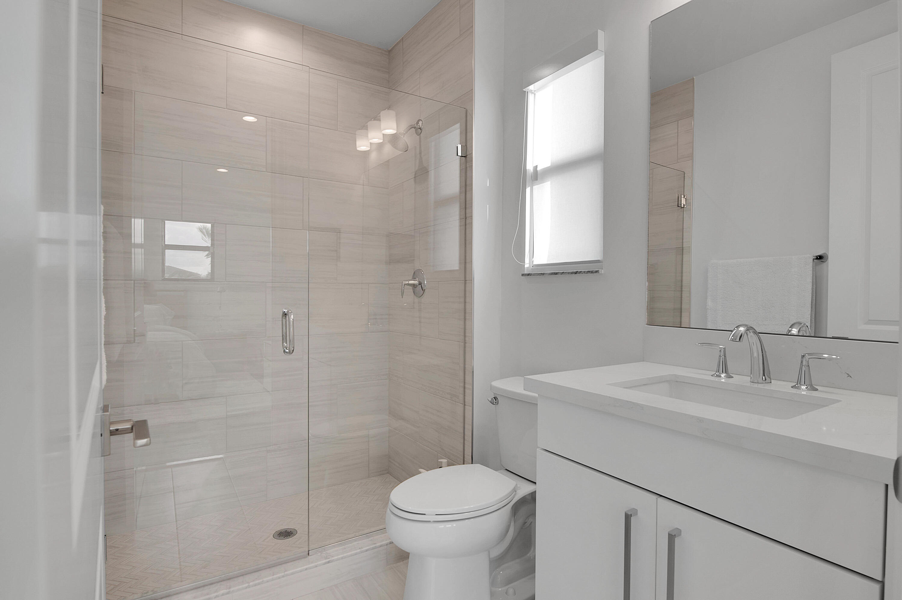 7480 Northwest 26th Way Boca Raton, FL 33496 - Photo 38 of 111 a bathroom with a sink toilet and shower