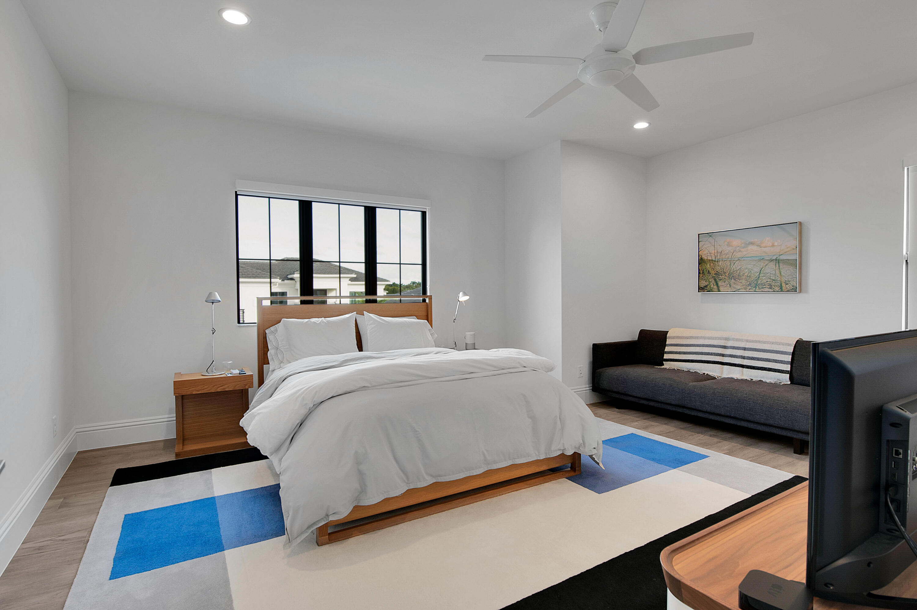 7480 Northwest 26th Way Boca Raton, FL 33496 - Photo 41 of 111 a bed room with a bed and a couch