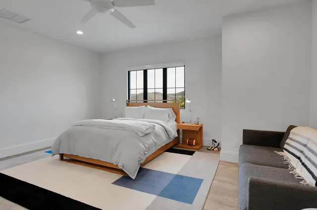 a view of a sign in front of flowers