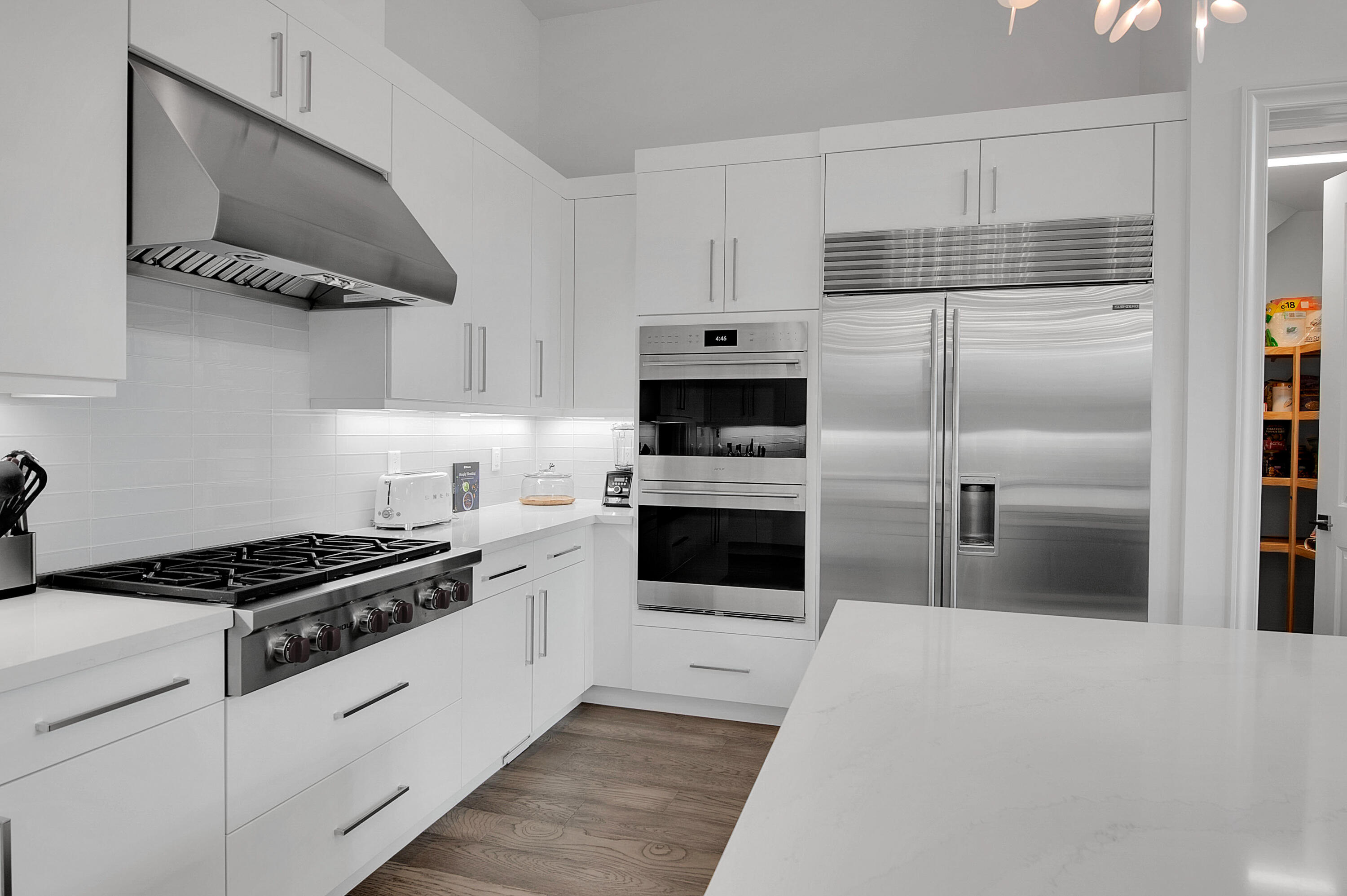 7480 Northwest 26th Way Boca Raton, FL 33496 - Photo 45 of 111 a kitchen with cabinets and steel stainless steel appliances