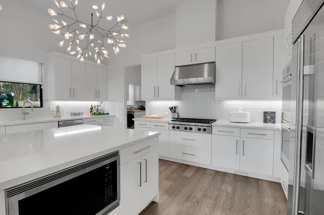 a view of a swimming pool with a patio and a garden