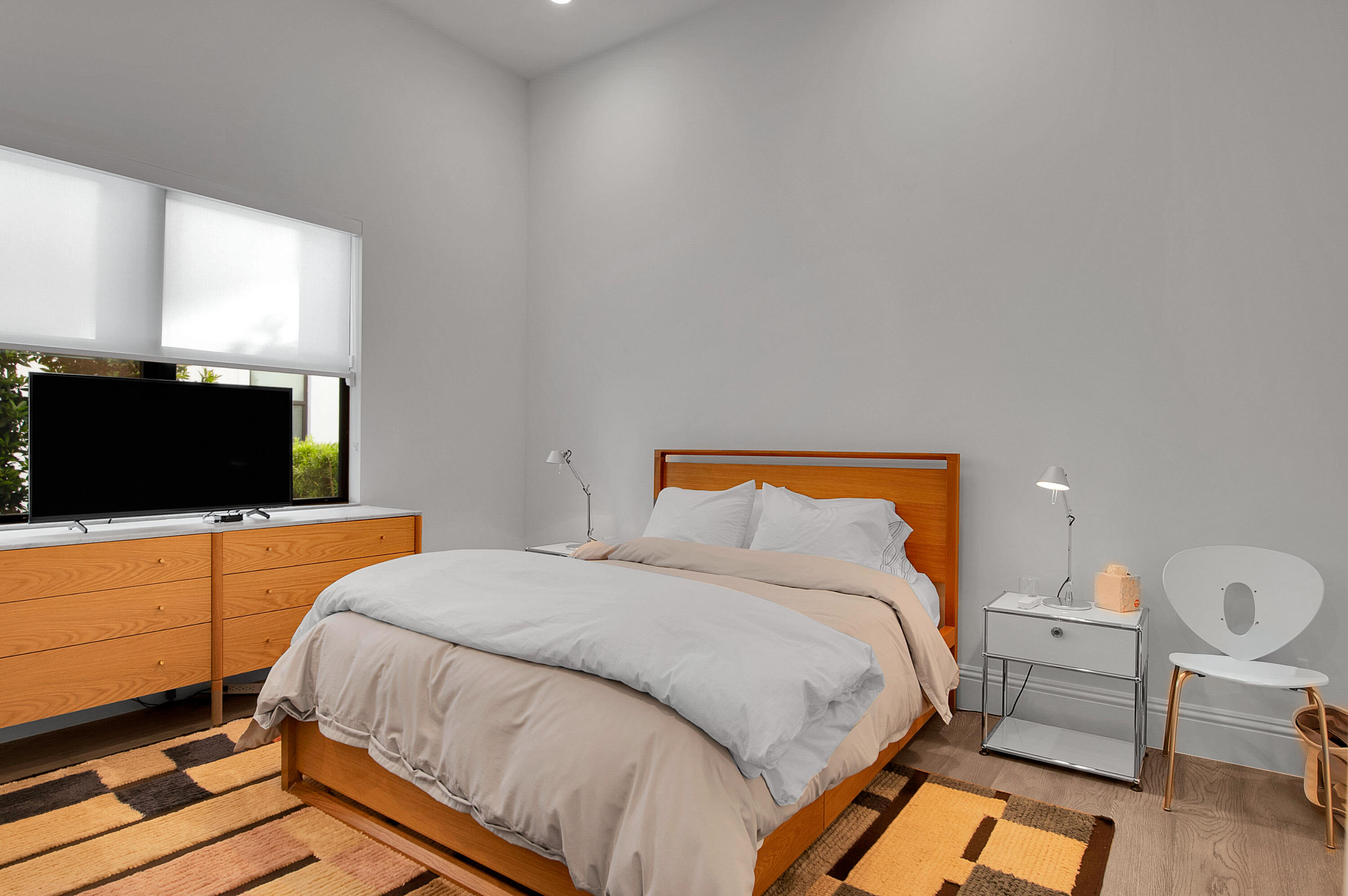 7480 Northwest 26th Way Boca Raton, FL 33496 - Photo 66 of 111 a bedroom with a bed and a flat screen tv