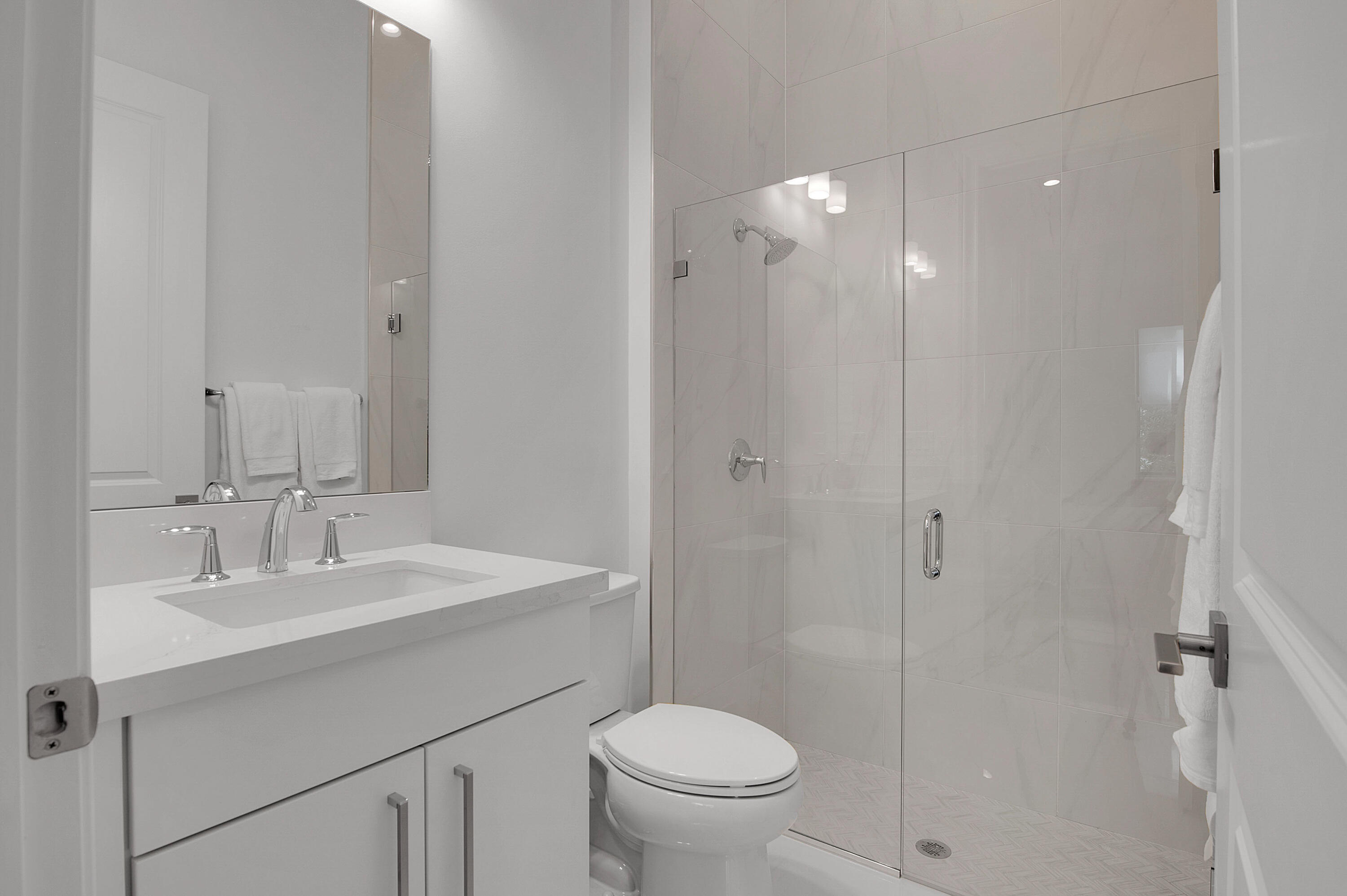 7480 Northwest 26th Way Boca Raton, FL 33496 - Photo 68 of 111 a bathroom with a sink toilet and shower