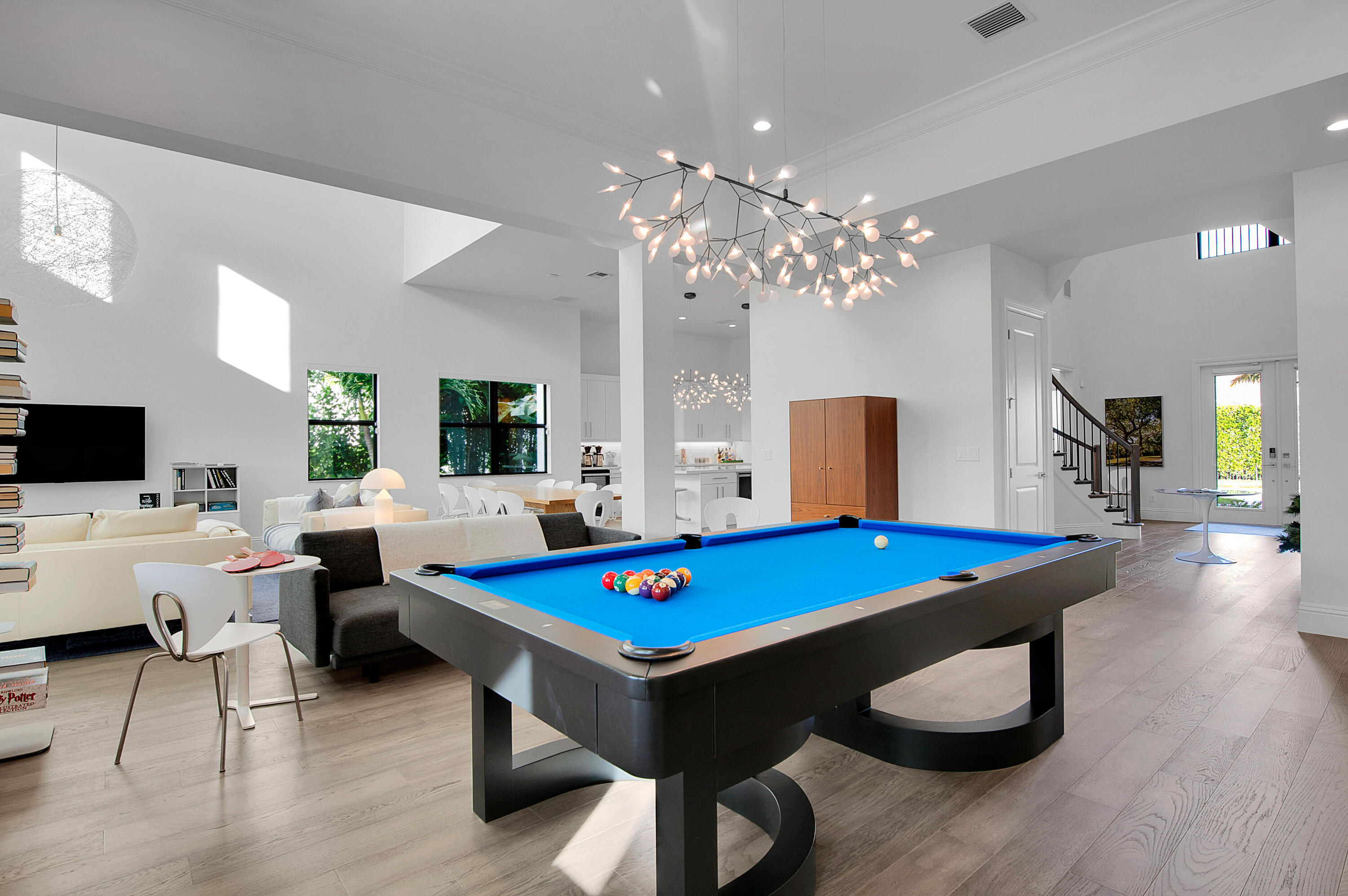 7480 Northwest 26th Way Boca Raton, FL 33496 - Photo 81 of 111 a room with furniture pool table flat screen tv and a chandelier