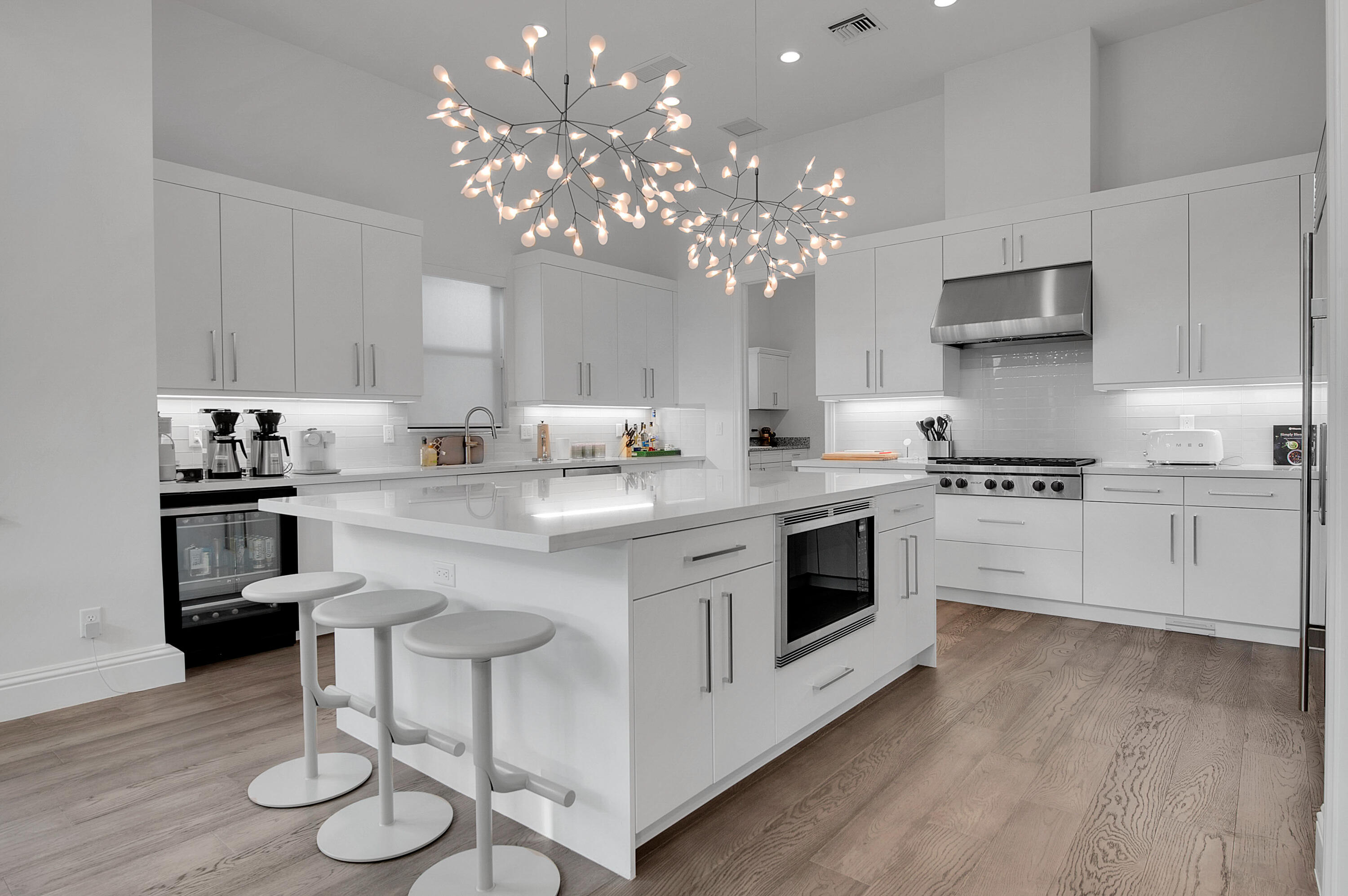 7480 Northwest 26th Way Boca Raton, FL 33496 - Photo 88 of 111 a kitchen with kitchen island granite countertop stainless steel appliances cabinets a dining table and chairs