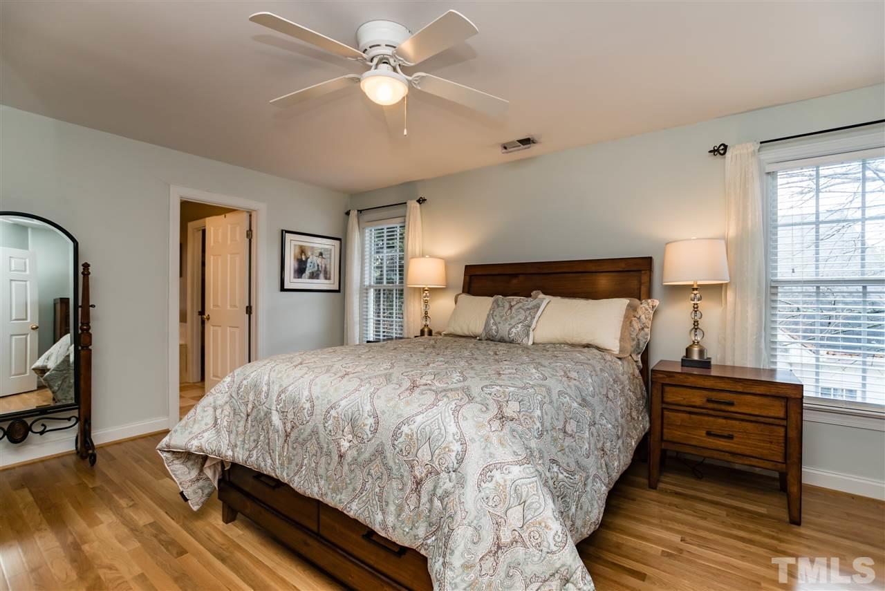 503 Scotts Ridge Trail Apex, NC 27502 - Photo 14 of 25 Spacious mater bedroom with newly replaced solid hardwood floor, ceiling fan, and a large WIC