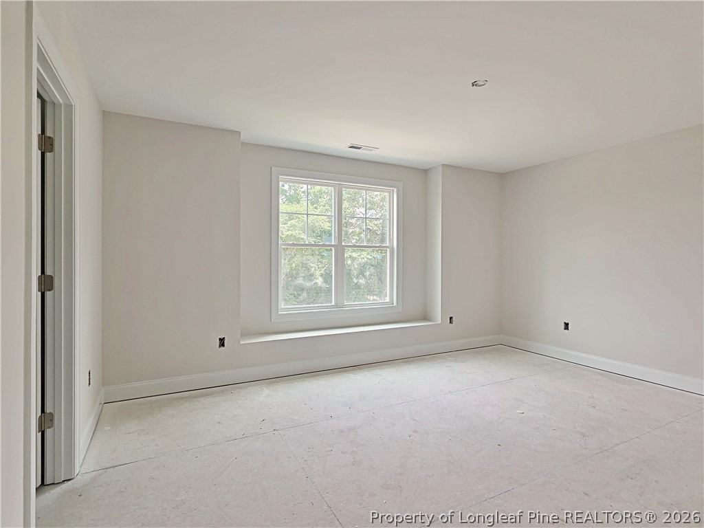 2678 Norrington Road Lillington, NC 27546 - Photo 21 of 31 a view of an empty room with a window