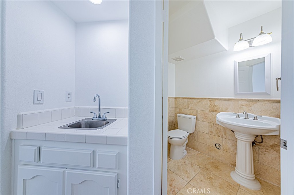 25533 Longfellow Place Stevenson Ranch, CA 91381 - Photo 16 of 47 a bathroom with a sink and toilet