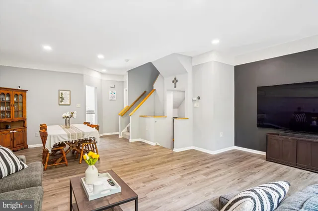 a room with a bed and a television