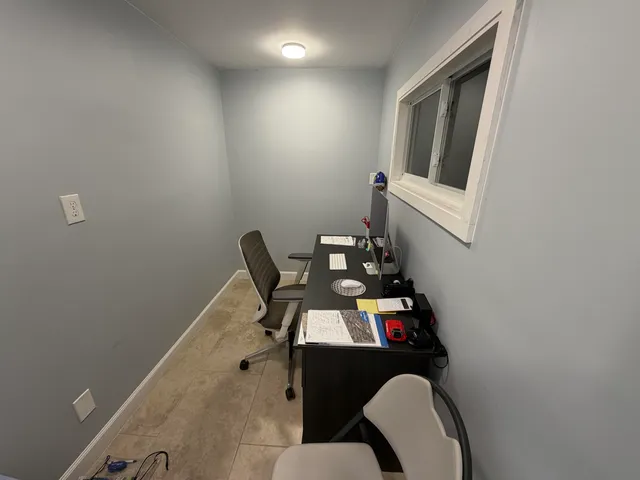 a bathroom with a toilet a sink and a mirror