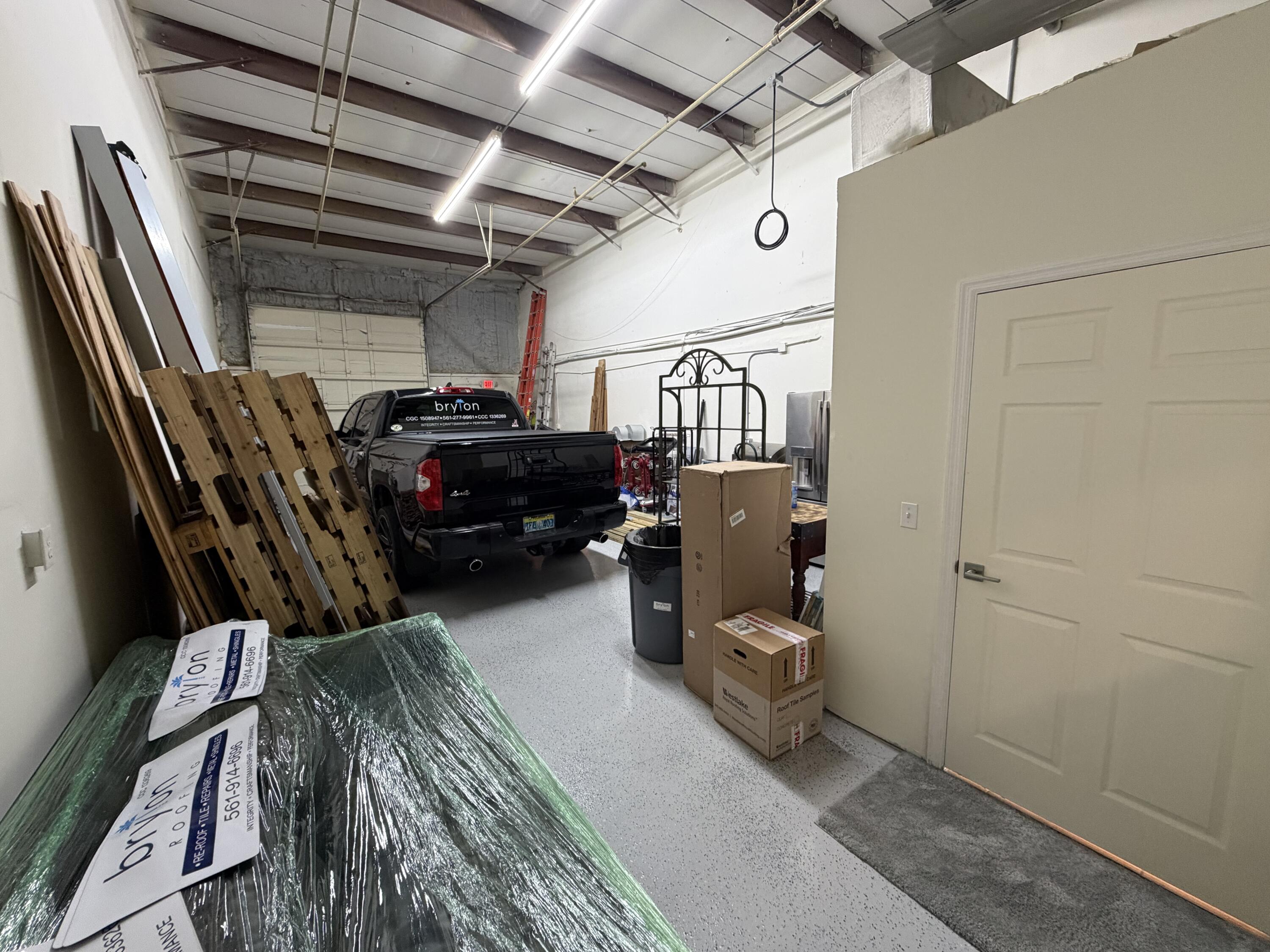 1312 Commerce Lane, Unit 3A Jupiter, FL 33458 - Photo 8 of 10 a view of car in garage