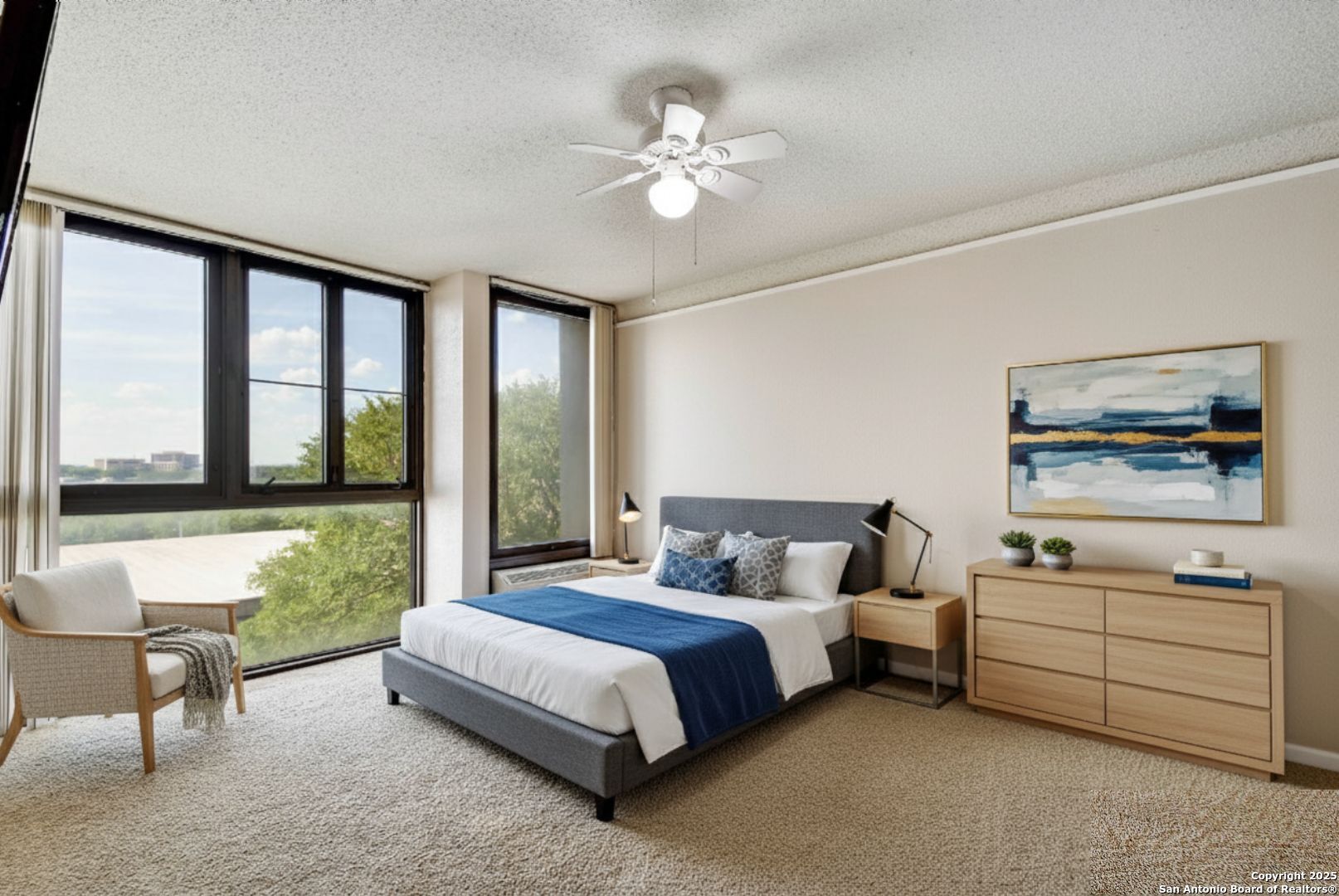 7701 Wurzbach Road, Unit 405 San Antonio, TX 78229 - Photo 12 of 42 a bedroom with a bed and a large window