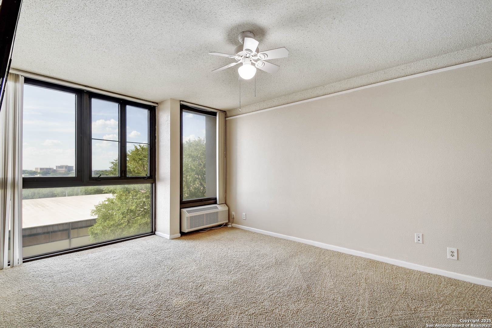 7701 Wurzbach Road, Unit 405 San Antonio, TX 78229 - Photo 13 of 42 a view of an empty room with a window