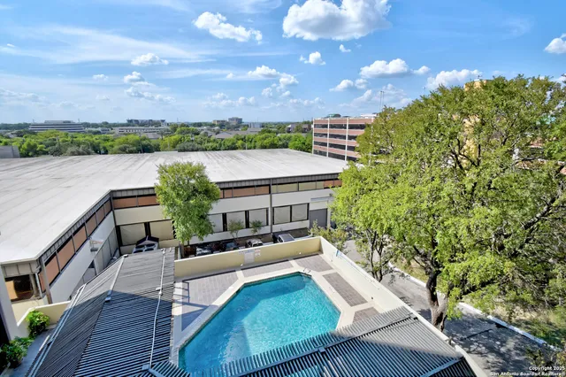 a view of balcony with furniture and city view