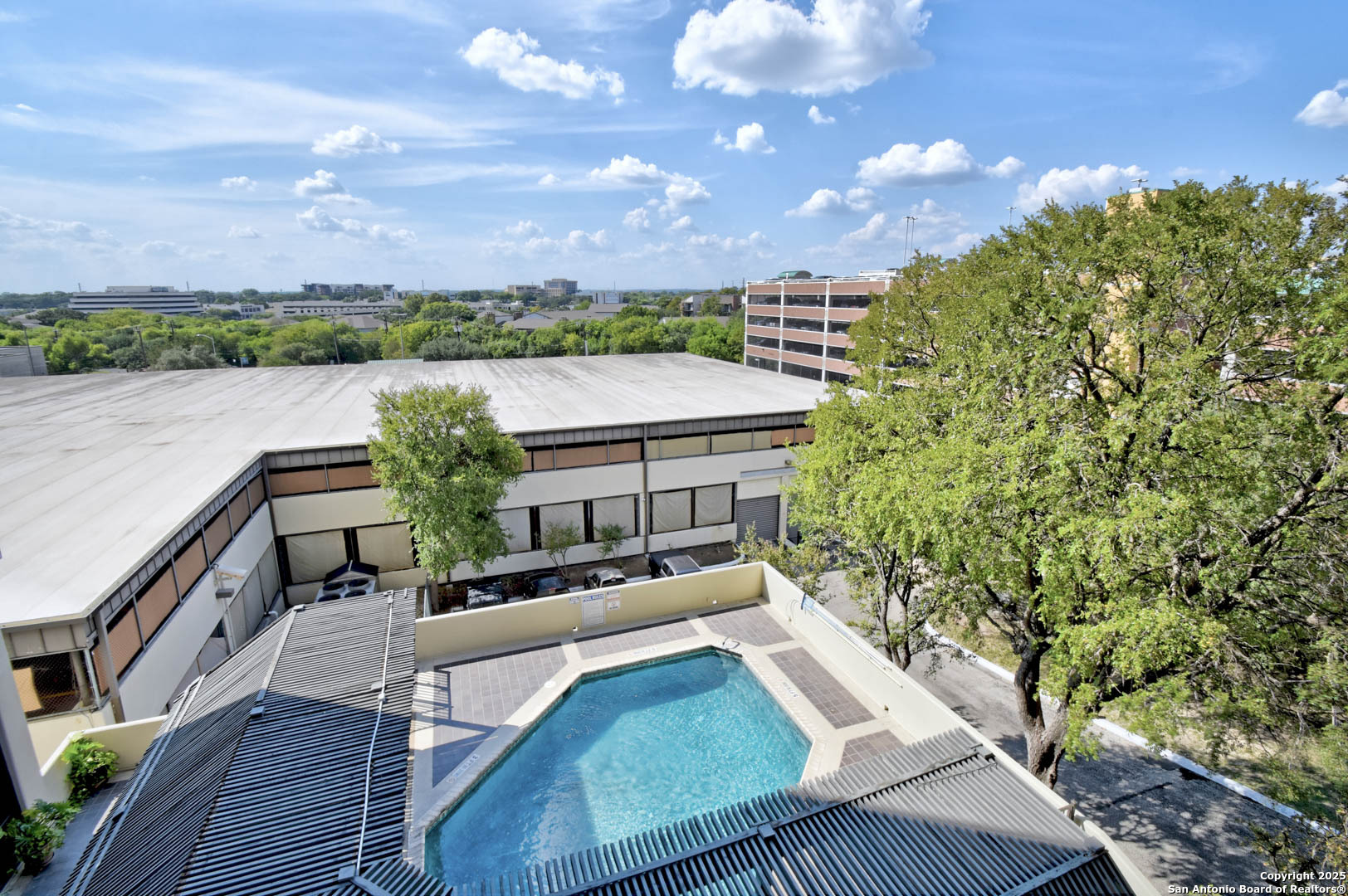 7701 Wurzbach Road, Unit 405 San Antonio, TX 78229 - Photo 22 of 42 a view of balcony with furniture and city view