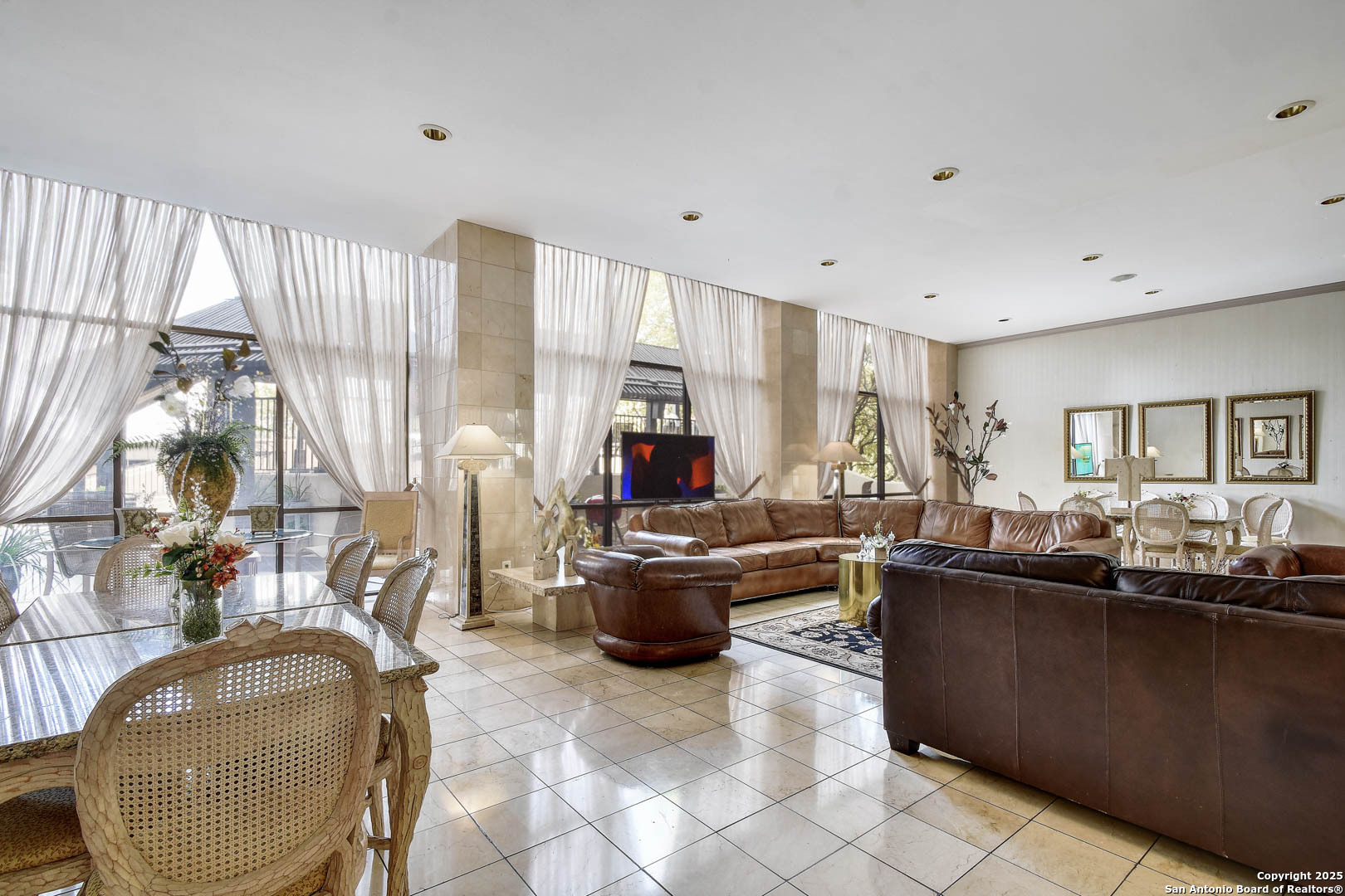 7701 Wurzbach Road, Unit 405 San Antonio, TX 78229 - Photo 25 of 42 a living room with furniture and a flat screen tv