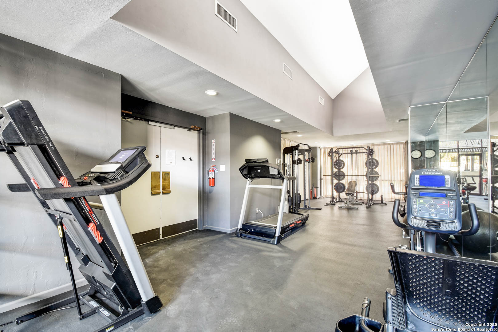 7701 Wurzbach Road, Unit 405 San Antonio, TX 78229 - Photo 29 of 42 a view of a room with gym equipment
